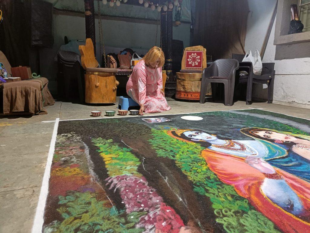 "Kshatrani" Binaba making a beautiful Rangoli painting of Radha-Krishna in Bhavnagar