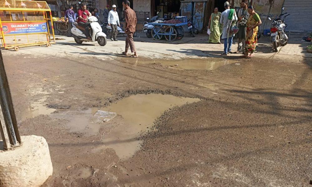 motorists-have-to-bear-the-brunt-of-waterlogging-due-to-large-potholes-near-sihore-main-bazar-bus-stand-ramp
