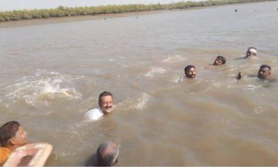 Rajula's Congress candidate Amrish Der reached out to the villagers by swimming in the sea for election campaign