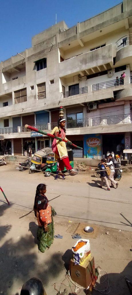 A helpless mother with a belly-crawling baby girl performed dangerous stunts near Sehore Municipality