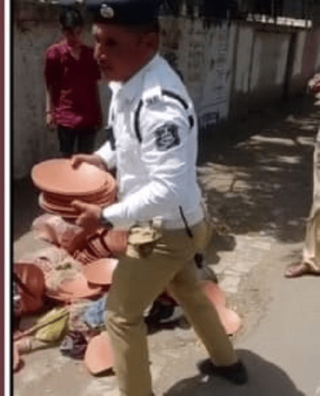 Bhavnagar; Policeman Ashok Makwana turning the sad tears of a poor and old lorry driver into happiness
