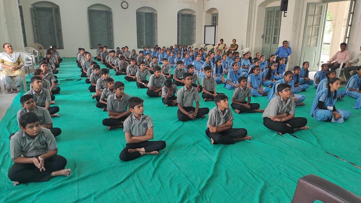 Distribution of books to students at Sehore Education Society with donations from a Mumbai-based donor.