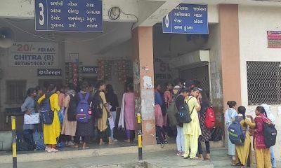 Sihor; Students stand in queue for half a day for bus passes