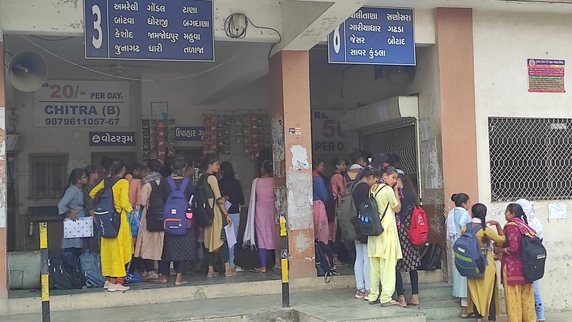 Sihor; Students stand in queue for half a day for bus passes