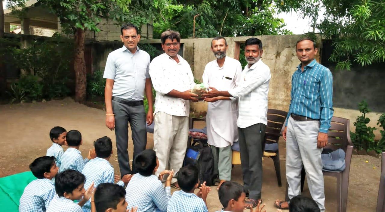 khakhara-seed-distribution-in-school-at-krishnapara-village-of-sihore-taluka